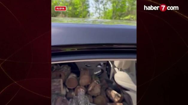 Rusya'da ilginç görüntü: Lüks otomobiliyle odun taşıdı